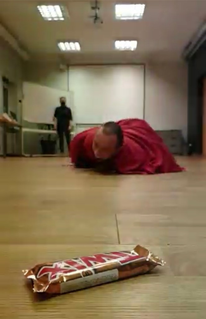 Burrito race for the prize - a twix bar in the foreground.