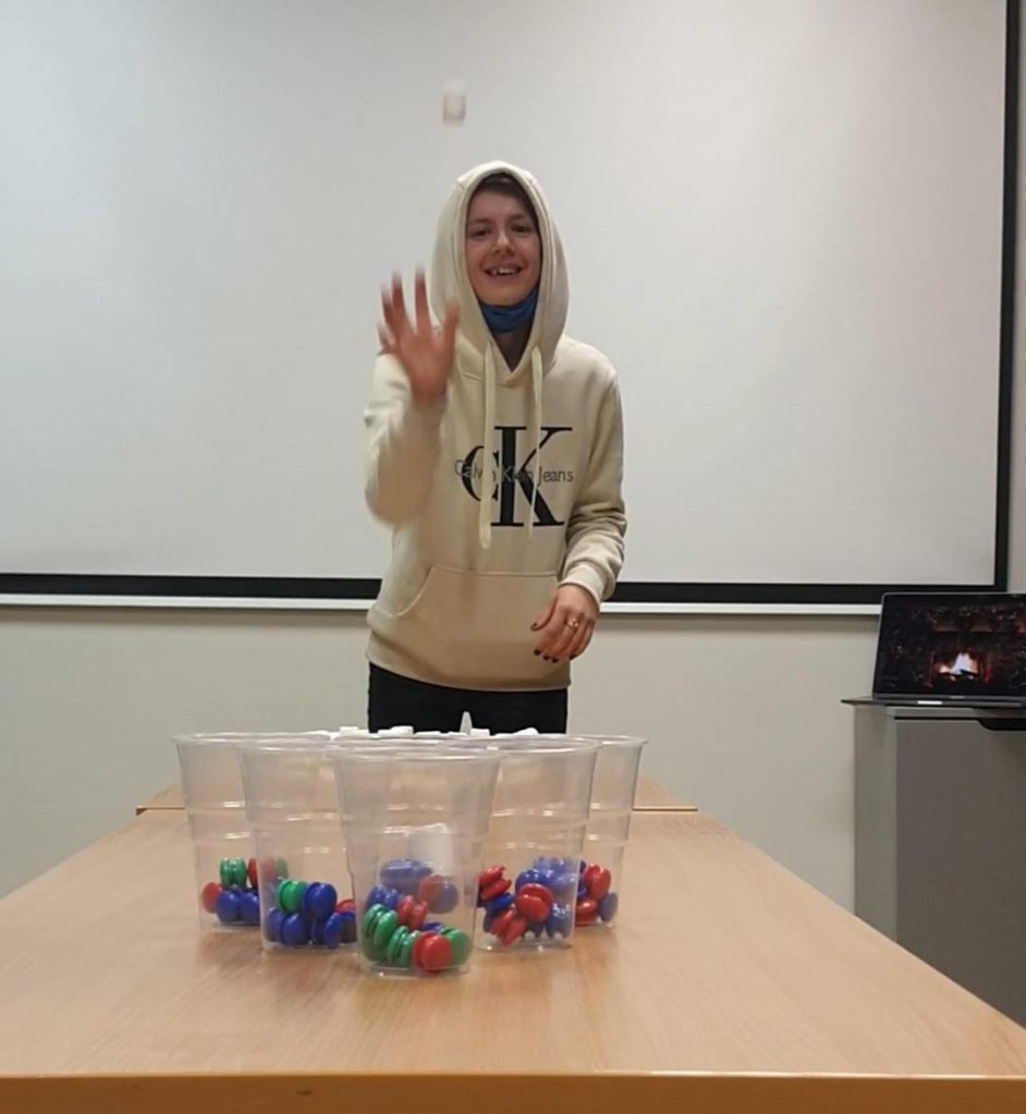 A youth throws a marshmallow during marshmallow pong
